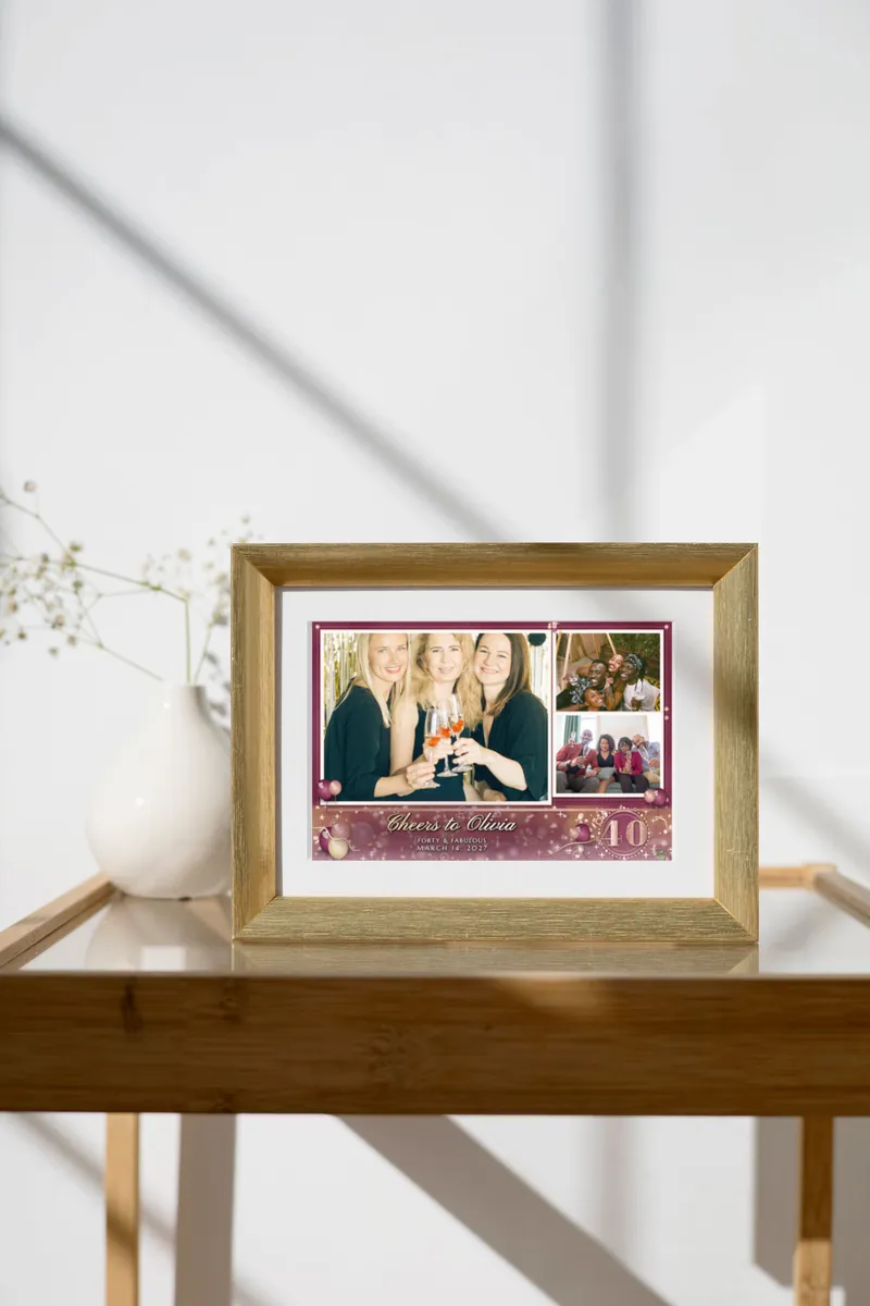 The Rose Gold Forty 4x6 print in a gold frame on a glass console