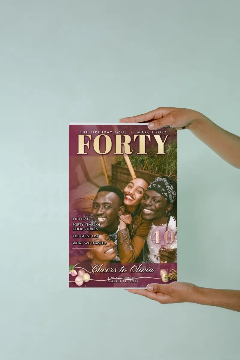 Two hands holding the Rose Gold Forty magazine cover print against a pale green wall