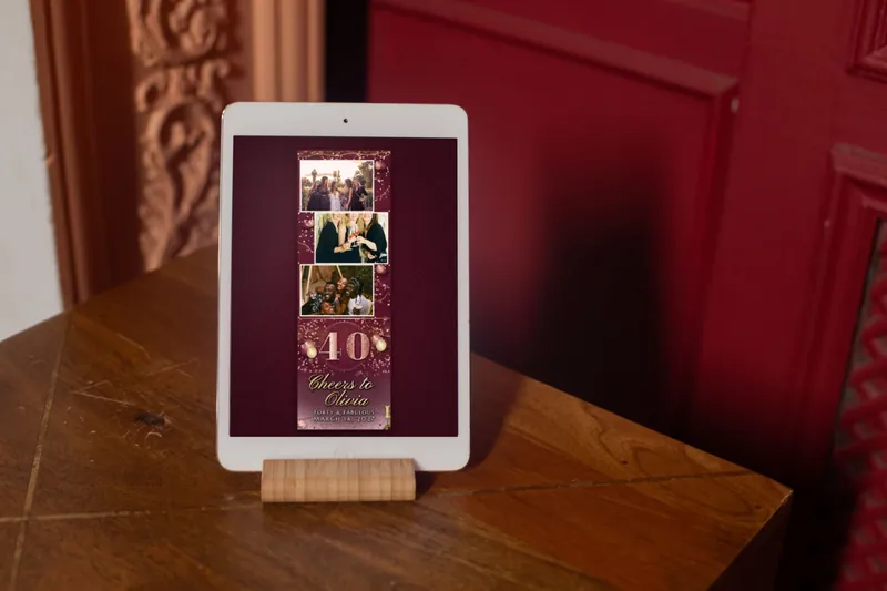 A Rose Gold Forty strip on a booth iPad on a wooden stand by a red door
